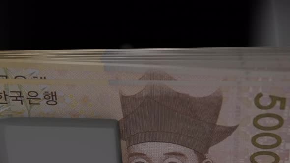 5000 South Korean won in cash dispenser. Withdrawal of cash from an ATM. alt