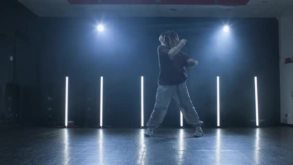 Studio Shot of Young Professional Dancer Performing Hiphop Moves alt