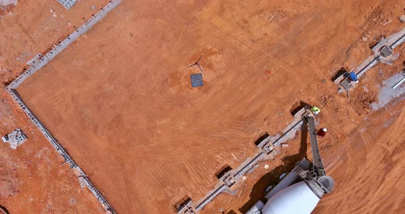 Using a Concrete Mixer Truck Concrete Columns Were Poured to Build a New House alt