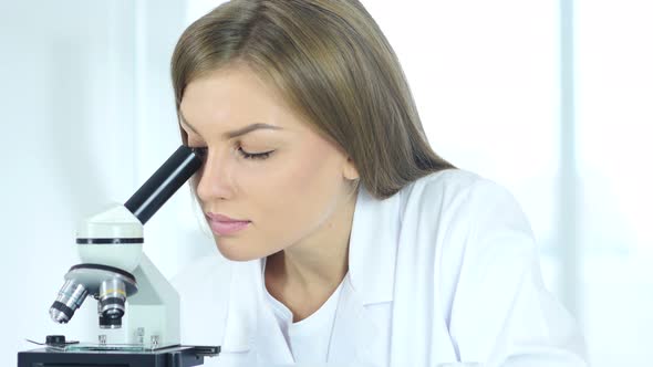Female Chemist, Doctor Working on Microscope in Laboratory alt