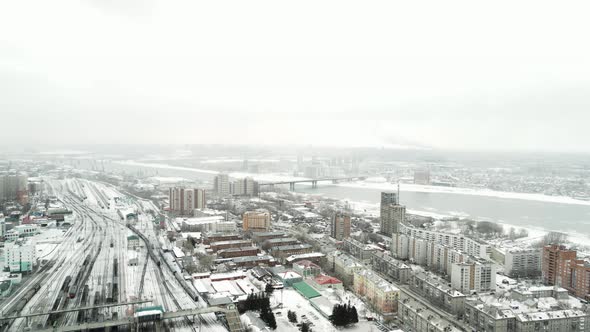 Aerial Survey of a Winter City in the Snowfall alt