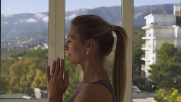 Woman Does Yoga Asanas Raising Hands in Namaste Mudra