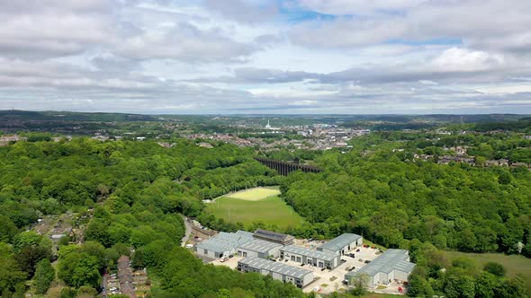 Aerial footage of a scenic view of the Lockwood Viaduct located in the town of Huddersfield in UK alt