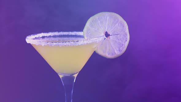 Barman Adds Fruit Slice To Cocktail In Club alt