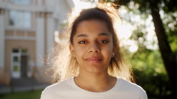 Portrait of Beautiful African American Young Woman Smiling at Camera Looking Confident alt
