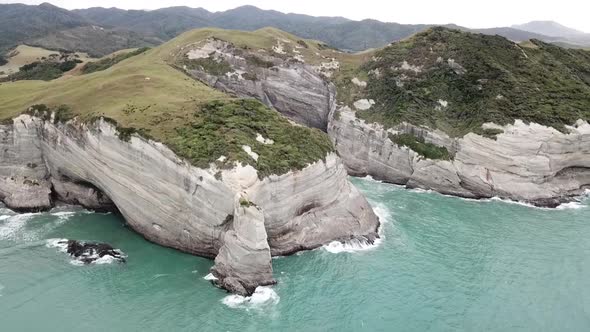 RISING AERIAL of New Zealands South Island rugged coastline alt