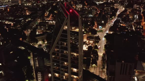 High Angle View of Modern Design Tall Residential Building and Urban District in Background alt