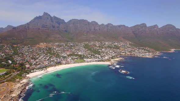 Aerial travel drone view of Camps Bay beach, Cape Town, South Africa. alt