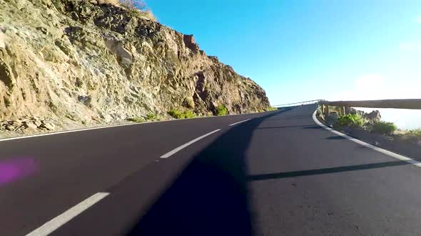 Long asphalt road ground view and travel concept - mountain and sky landscape alt