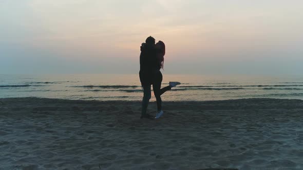 Hot Couple Kiss on the Beach During Sunset