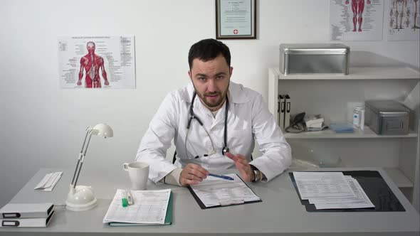 Doctor Seriously Explaining To Camera alt