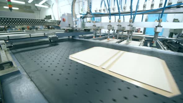 Twopage Book Spreads are Being Made By a Factory Conveyor alt