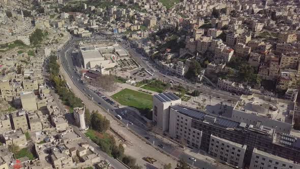 Scenic aerial shot taken by a drone in the middle of a bright sunny morning in Amman Jordan showing alt