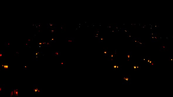 Halloween. Night cemetery with glowing lamps and burning candles alt