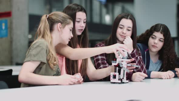 Children working with small robot