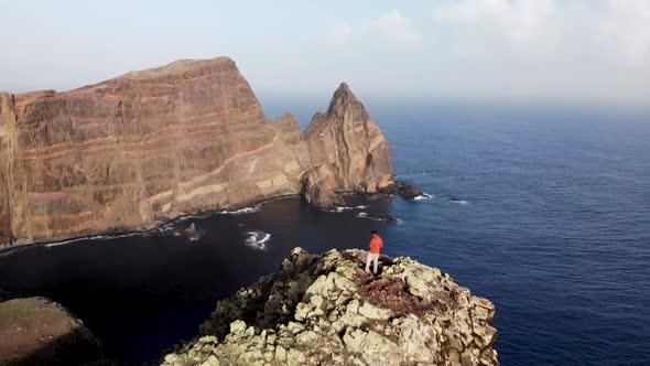 Man Standing on Ponta de Sao Lourenco Coastline Cliffs, Madeira island, Portugal