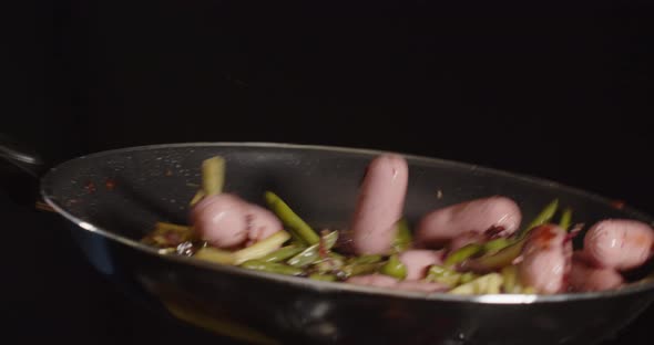 Cooking In A Pan. Asparagus With Sausages. Cooking