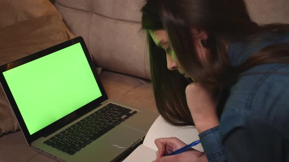 Portrait of Woman Calling Video on Laptop Green Screen Chromakey alt