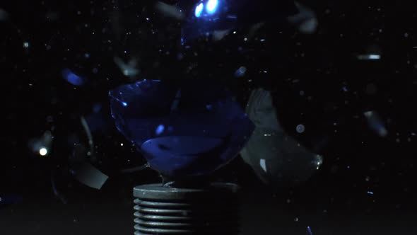 Slow motion of christmas ornament shattering alt