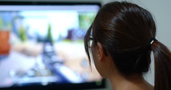 Woman play game on computer alt