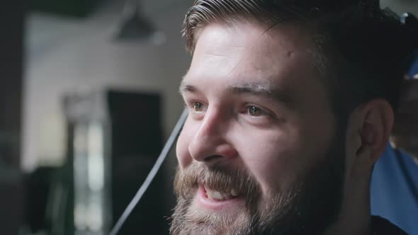 Hairstylist Drying Hair of Client in Barbershop alt
