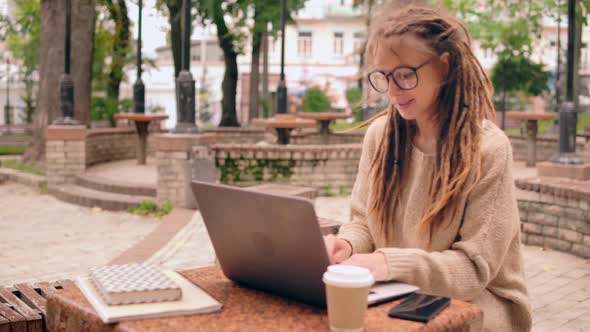 Side View Smiling Girl Works Outdoors alt
