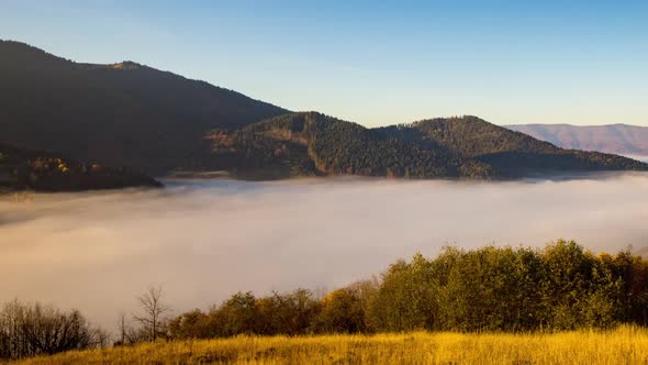 Thick Morning Fog Fills Highland Deep Valley Among Mountains alt