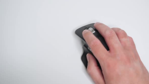 Top View on the Man's Hand Using Modern Wireless Laser Mouse alt