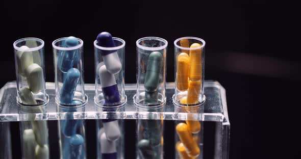 Test Tubes Filled with Pills and Drugs alt
