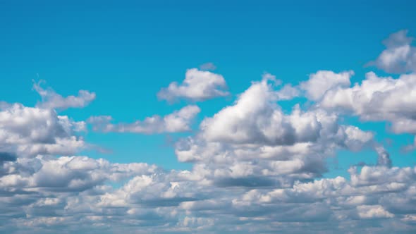 Cumulus Cirrus Clouds Move in the Blue Sky. Time Lapse alt