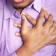 Young Man Suffering Pain in Heart and Holding Chest with Hand - VideoHive Item for Sale