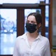 Cute young woman hotel guest wearing protective mask to protect from coronavirus. - VideoHive Item for Sale