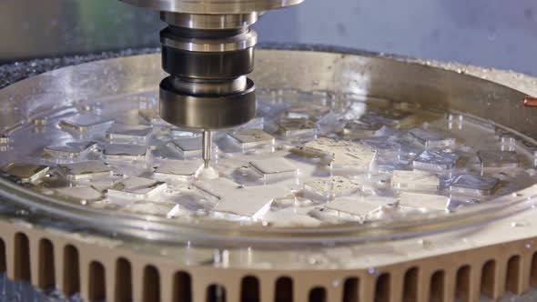 Machining process - high precision CNC mill manufacturing an advanced metal part alt