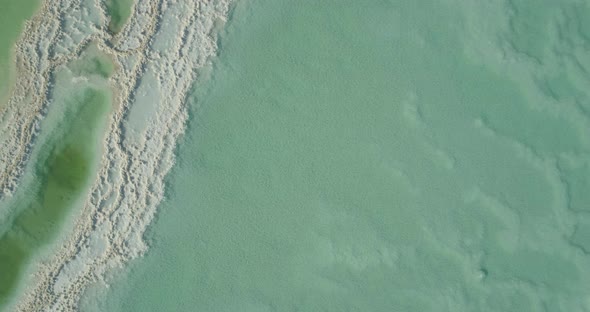 Aerial view of colourful sinkholes. The Dead sea, Negev, Israel. alt