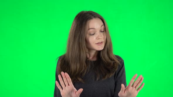 Portrait of European Woman Is Strictly Gesturing with Hands Crossed Making X Shape Meaning Denial alt