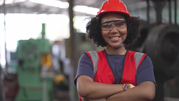 Portrait of African American female factory worker in safety clothing