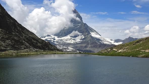 Time-lapse snowy Matterhorn peak and lake Stellisee, Swiss Alps, Zermatt