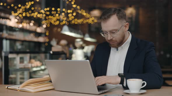 Businessman Typing on Laptop alt