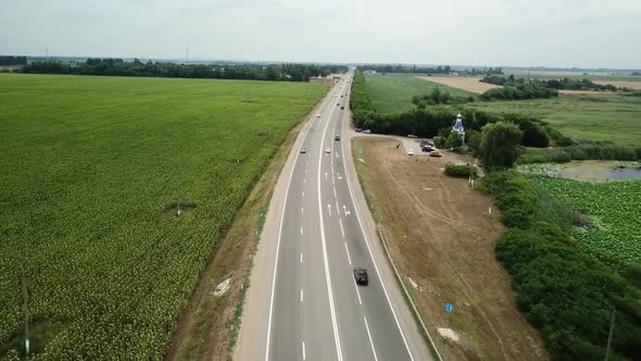 Aerial Fly Over Motorway, Freeway Traffic - Trucks and Cars on the Road alt