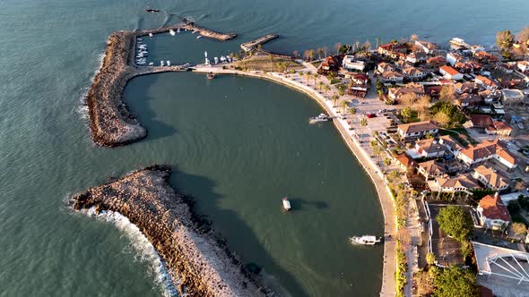Yacht sails out of port Aerial View 4 K alt
