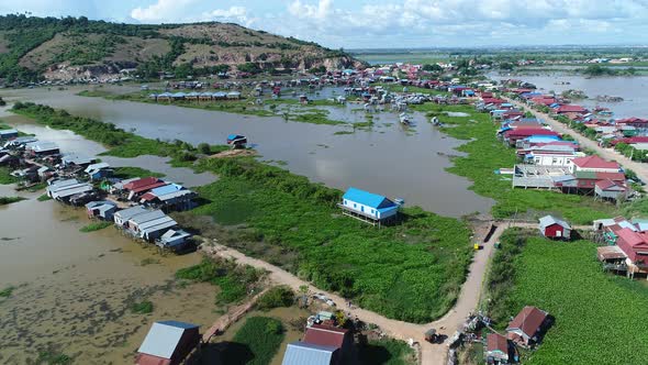 Farming and fishing village near Siem Reap in Cambodia seen from the sky alt