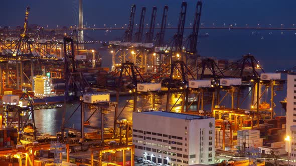 Container Port Illuminated Hong Kong Harbour with Gantry Cranes alt