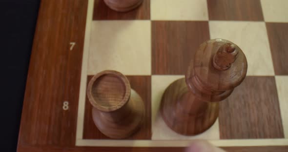 Close Up Top View of Player Making Castling Move Protecting King Playing Wooden Chess alt