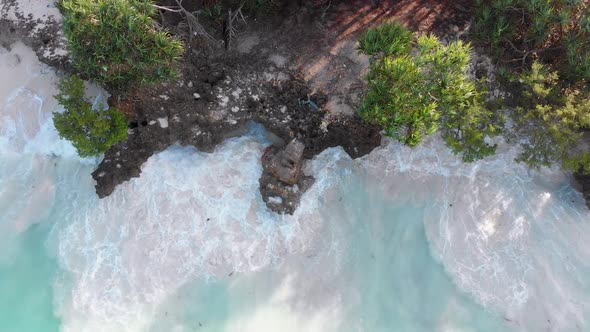 Aerial Top of Tidal White Waves Hit the Coral Reef on Rocky Coastline Zanzibar alt