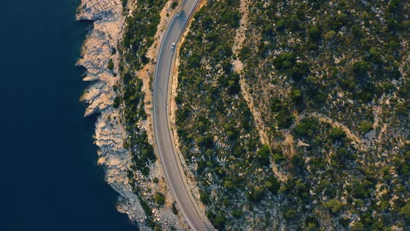 Aerial Drone View of Mountain Road Near the Turquoise Sea in Summer alt