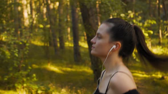 Girl in Headphones Jogging