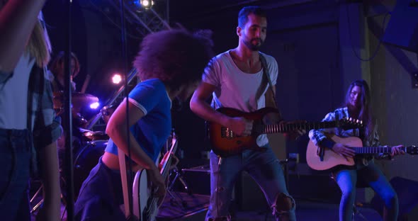 Musicians performing during a concert alt