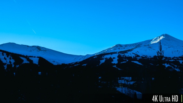 4K Time Lapse of Winter Mountain Landscape During Sunset alt