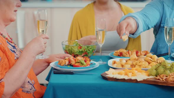 Senior Woman Holding a Glass of Wine alt