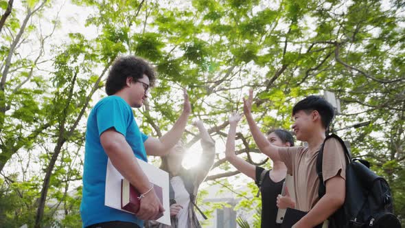 Asian student friends greeting together in college. Education and student.